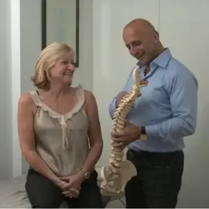 Paul Younane doing physiotherapy with a client